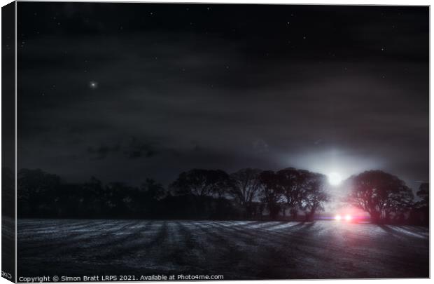 Lone driver in a dark field Canvas Print by Simon Bratt LRPS
