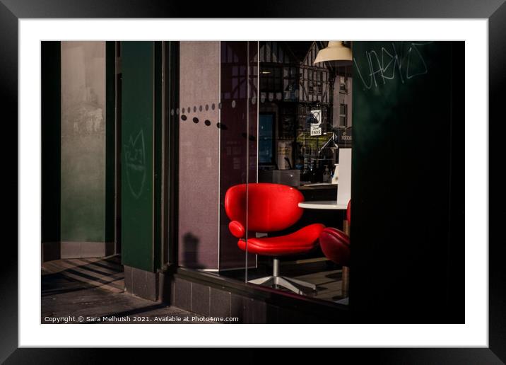 The red chair Framed Mounted Print by Sara Melhuish