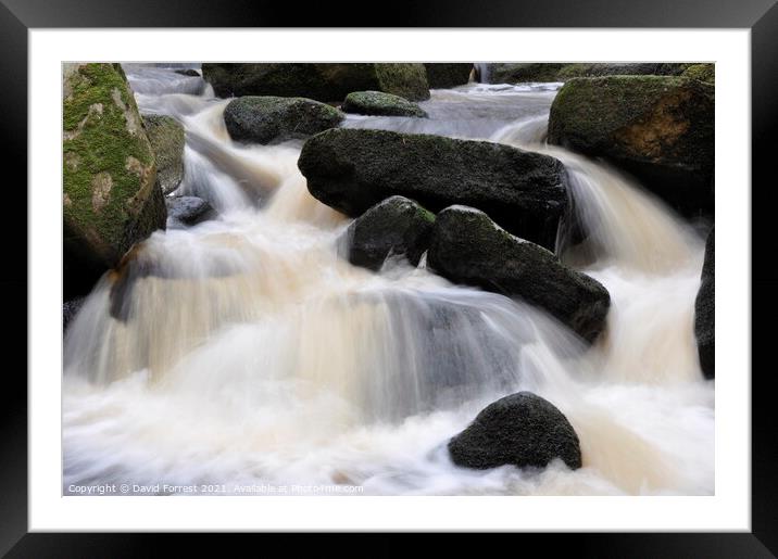 Water flowing down between rocks Framed Mounted Print by David Forrest