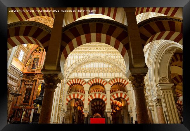 Pillars and arches in Cordoba Cathedral Framed Print by Angus McComiskey