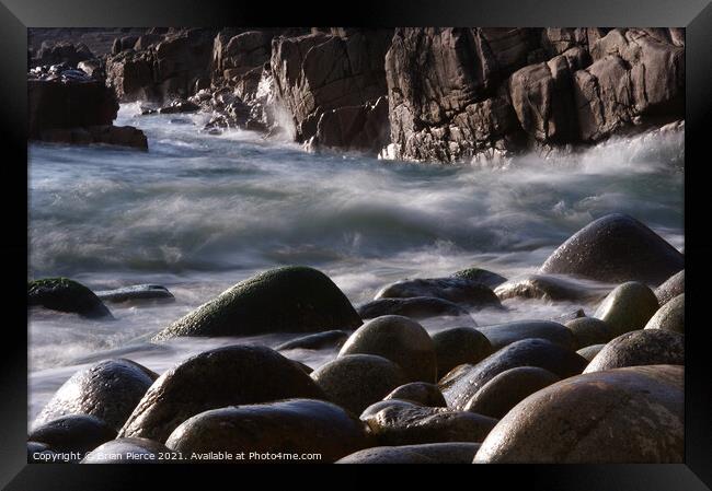 Rocks on the beach at Poerth Navern, Cornwall Framed Print by Brian Pierce