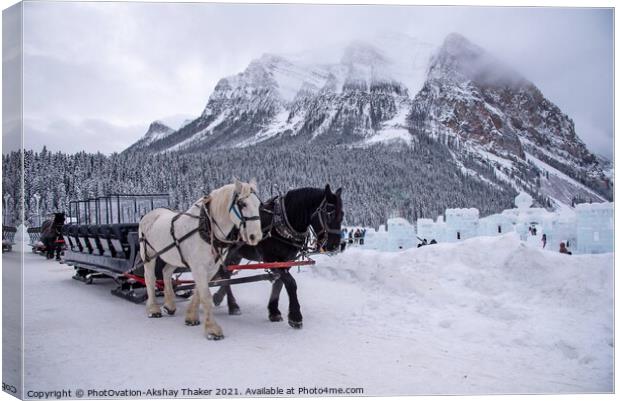 A Christmassy horse sledge in lake Louise in Banff Canvas Print by PhotOvation-Akshay Thaker