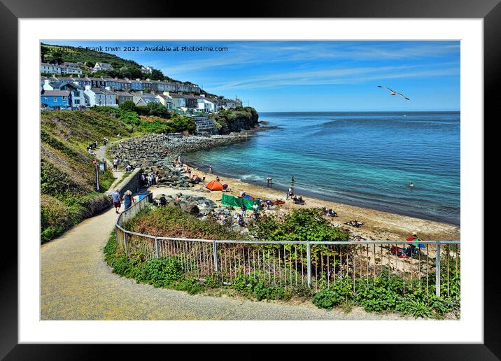 Enjoying time in the sunshine on New Quay beach Framed Mounted Print by Frank Irwin