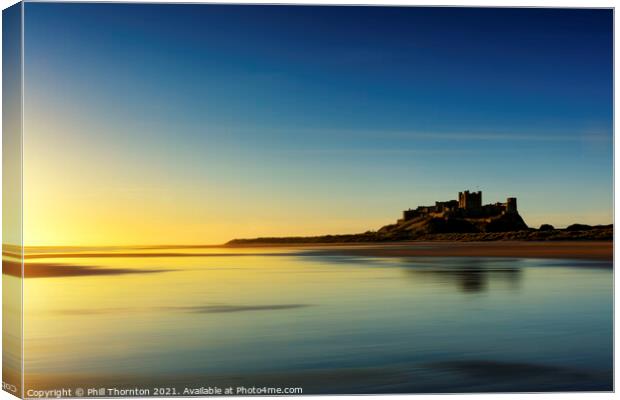 Sunrise over Bamburgh Castle No. 4 Canvas Print by Phill Thornton