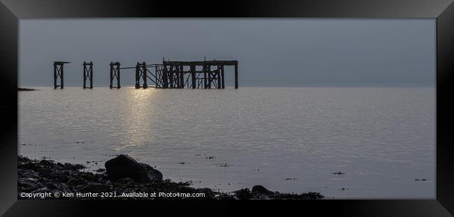 Ruined Wooden Pier at Sunrise Framed Print by Ken Hunter