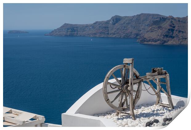 Spinning wheel over ocean on Santorini Print by Steve Heap