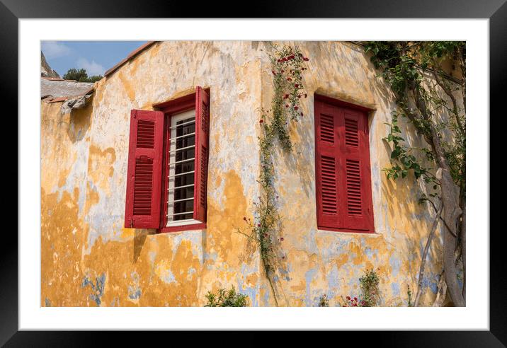 Red shutters on window in ancient district of Anafiotika in Athe Framed Mounted Print by Steve Heap