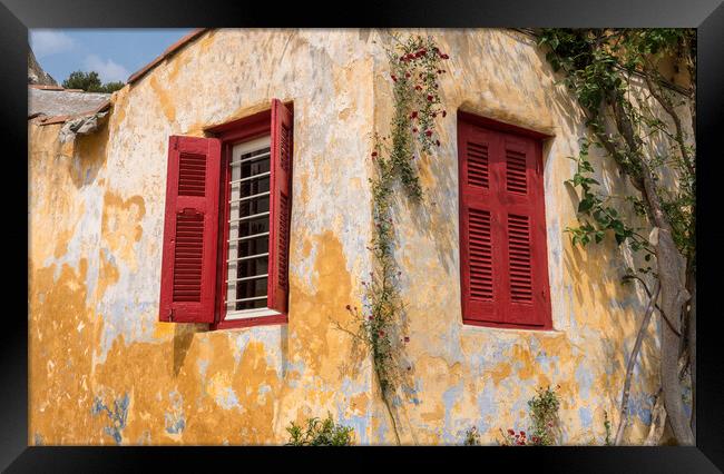 Red shutters on window in ancient district of Anafiotika in Athe Framed Print by Steve Heap