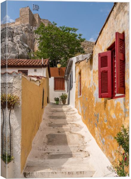 Narrow street in ancient residential district of Anafiotika in A Canvas Print by Steve Heap