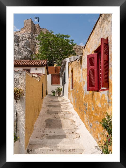 Narrow street in ancient residential district of Anafiotika in A Framed Mounted Print by Steve Heap