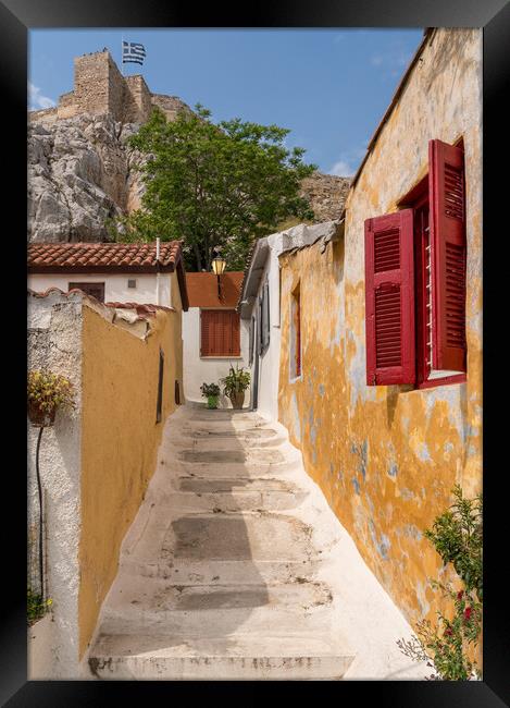 Narrow street in ancient residential district of Anafiotika in A Framed Print by Steve Heap