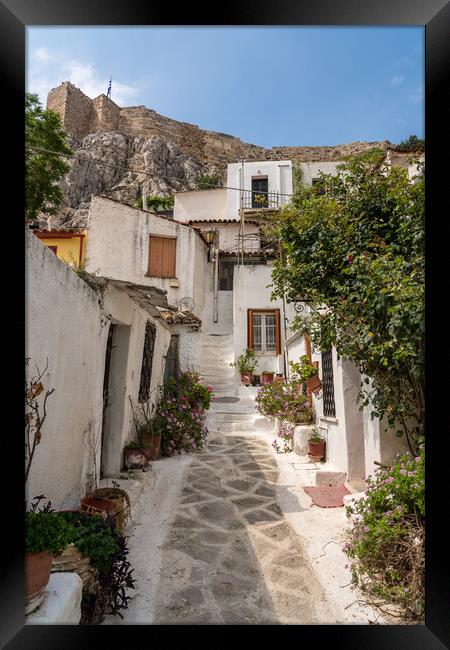 Narrow street in ancient residential district of Anafiotika in A Framed Print by Steve Heap