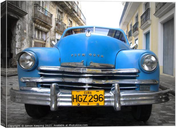 PLYMOUTH CAR IN HAVANA Canvas Print by Simon Keeping