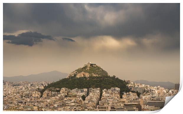 Lycabettus hill rises above Athens on stormy day Print by Steve Heap