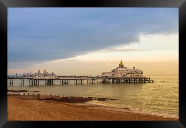 Storm clouds over Eastbourne pier Framed Print by Andy Dow