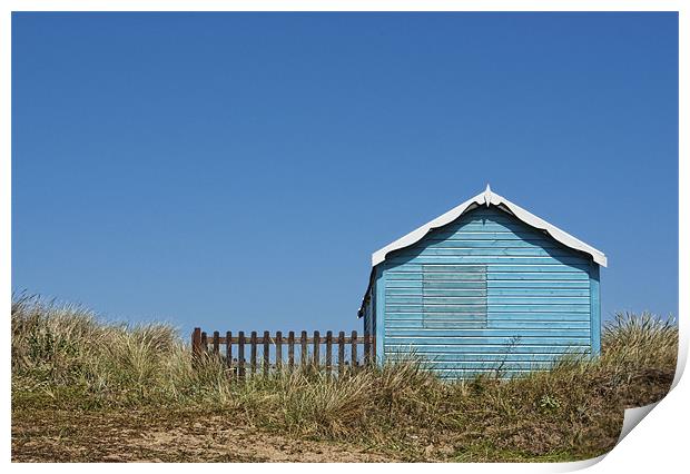 Blue beach hut on a hill Print by John Edwards