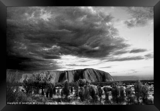 Storm Clouds over Uluru Framed Print by Jonathan Bird