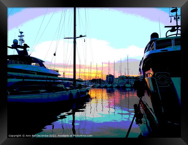 A posterized sunset behind the boats in Cannes Framed Print by Ann Biddlecombe