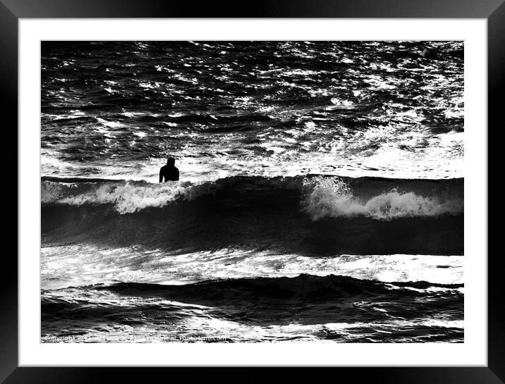 Silhouetted surfer in a large wave Framed Mounted Print by That Foto