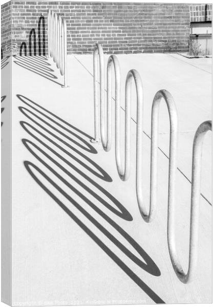 Bike rack shadows cast form abstract shapes on concrete Canvas Print by Blok Photo 