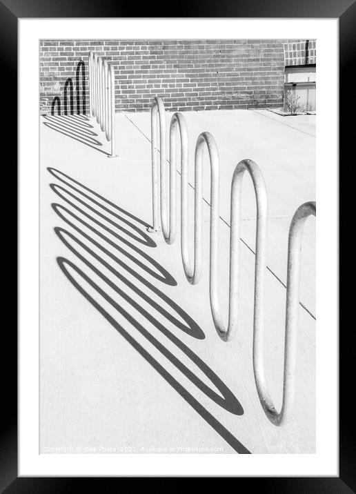 Bike rack shadows cast form abstract shapes on concrete Framed Mounted Print by Blok Photo 