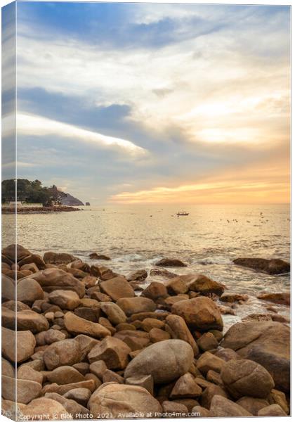 Dramatic Setting Sun and Rocky Shore  Canvas Print by Blok Photo 