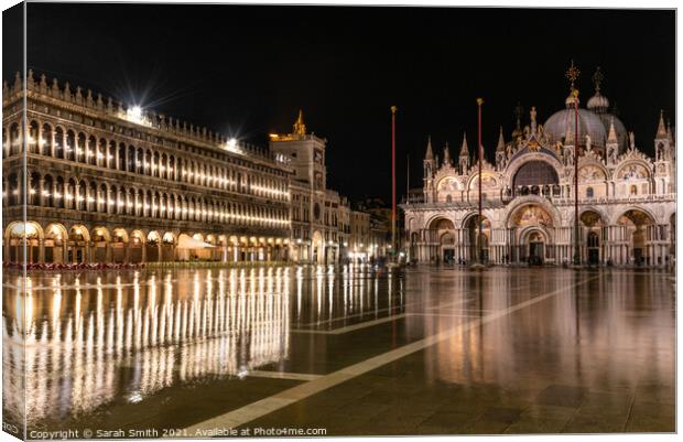 St Mark's Basilica stands in a flooded piazza at night Canvas Print by Sarah Smith