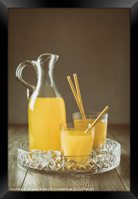 Jug Of Orange Drink Framed Print by Amanda Elwell