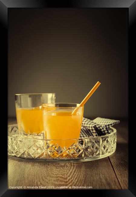 Glasses Of Orange Juice Framed Print by Amanda Elwell