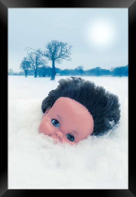Dolls Head In Snow Framed Print by Amanda Elwell