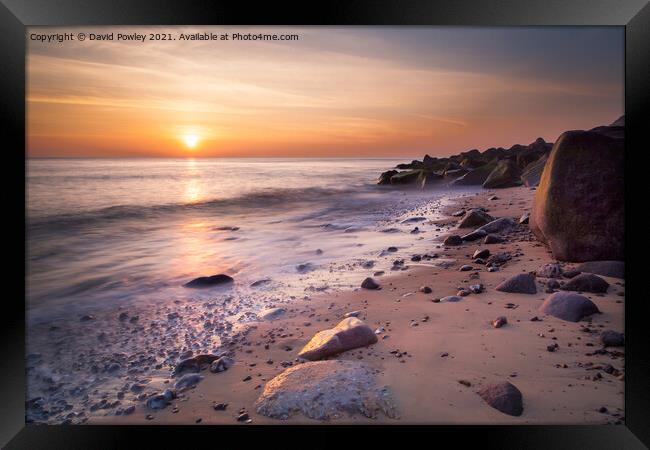 Sunrise Glow on Sheringham Beach Norfolk Framed Print by David Powley