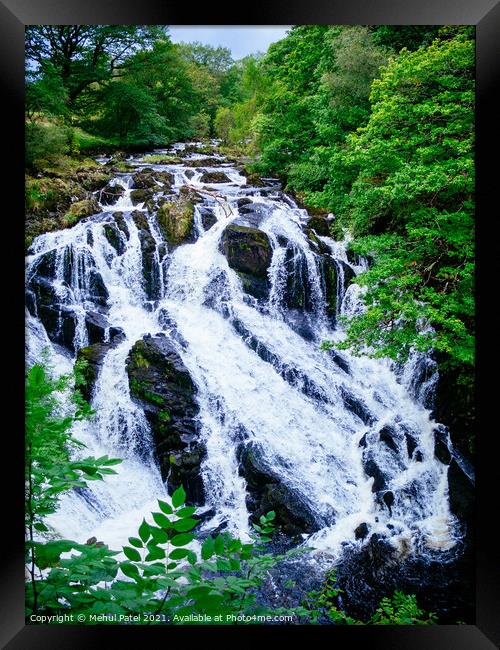 A large waterfall in a forest - Swallow Falls, Wales Framed Print by Mehul Patel
