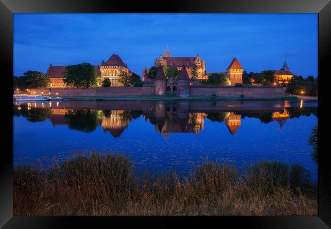 Malbork Castle at Night in Poland Framed Print by Artur Bogacki