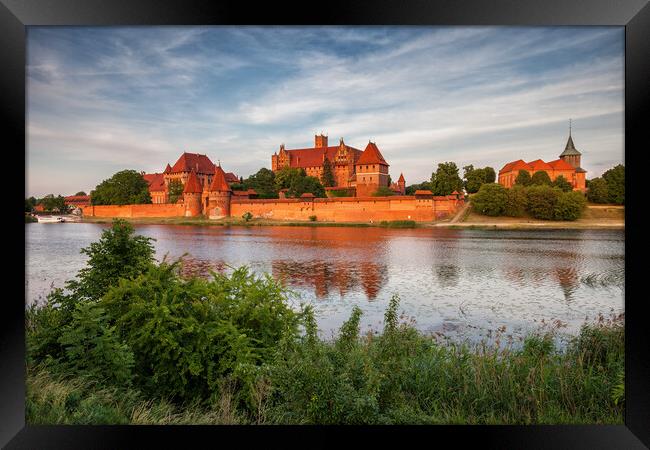 Malbork Castle in Poland at Sunset Framed Print by Artur Bogacki