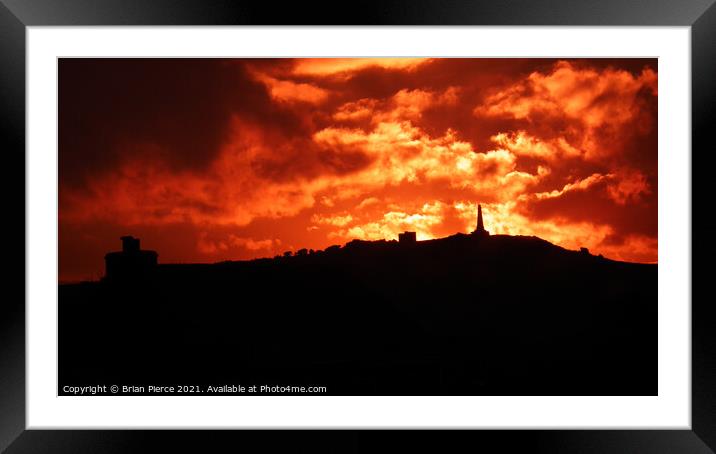 Fiery sunset over Carn Brea, Cornwall  Framed Mounted Print by Brian Pierce