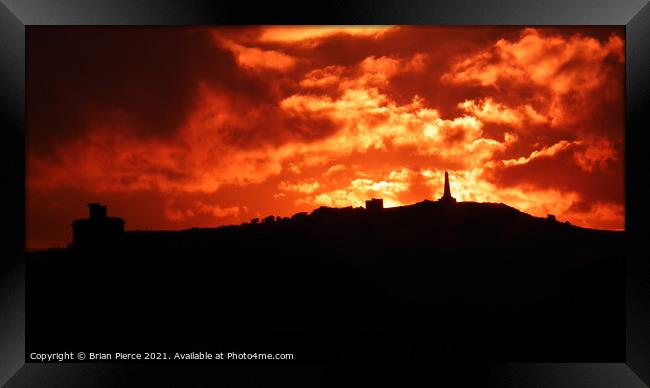 Fiery sunset over Carn Brea, Cornwall  Framed Print by Brian Pierce