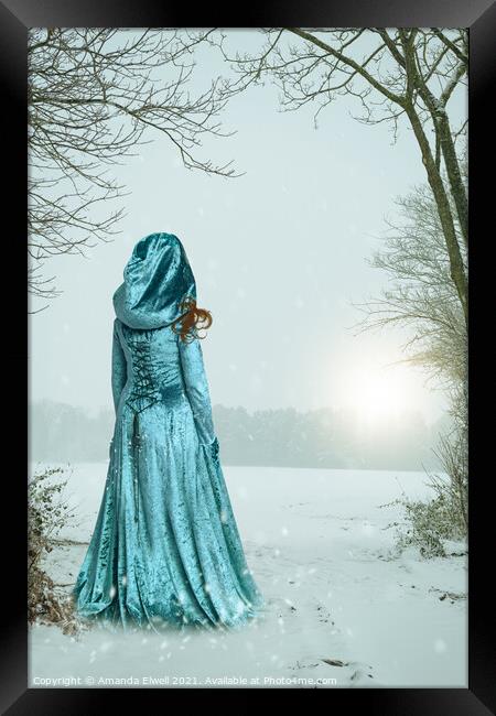 Robed Woman In Snow Framed Print by Amanda Elwell