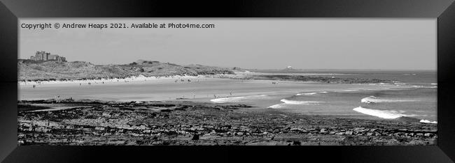 Rocky beach scene and waves on Beach near Dunstanburgh castle. Framed Print by Andrew Heaps