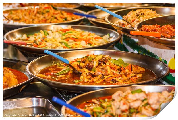 Platters of Thai food on a street food stall Print by Kevin Hellon