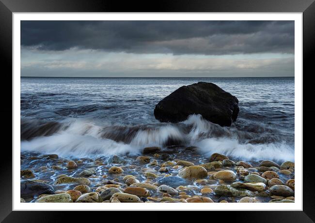 single rock on a stony beach At Hayburnwyke 171 Framed Print by PHILIP CHALK