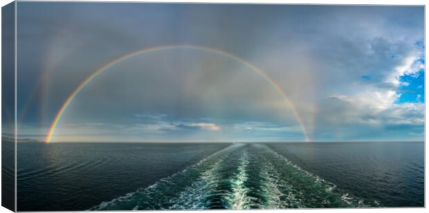 Dramatic double rainbow forms over the wake of a cruise ship at  Canvas Print by Steve Heap
