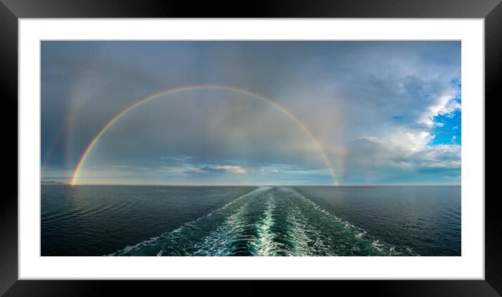 Dramatic double rainbow forms over the wake of a cruise ship at  Framed Mounted Print by Steve Heap