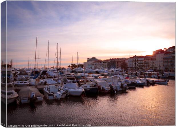  Cannes marina at sunset Canvas Print by Ann Biddlecombe