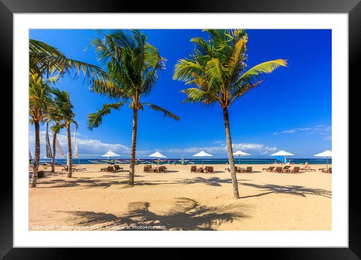 Sunbeds and palm trees Framed Mounted Print by Kevin Hellon
