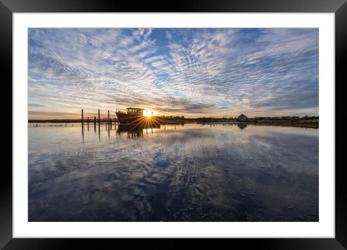 Sunrise reflections at Thornham Framed Mounted Print by Gary Pearson