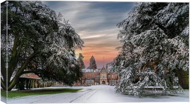 Sunset over a snow covered Tylney Hall Hotel Canvas Print by Dave Williams