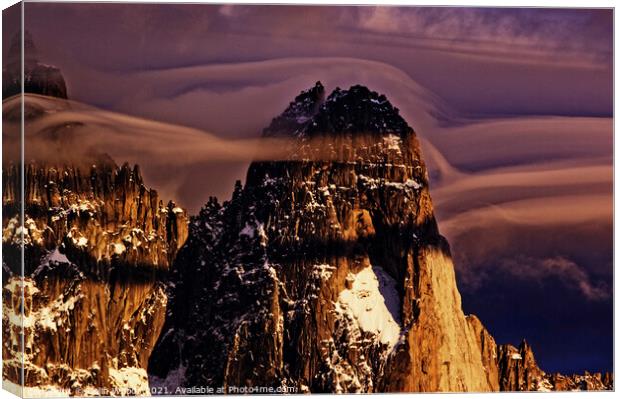 Clouds forming around the Aiguille de Dru in the French Alps Canvas Print by Colin Woods