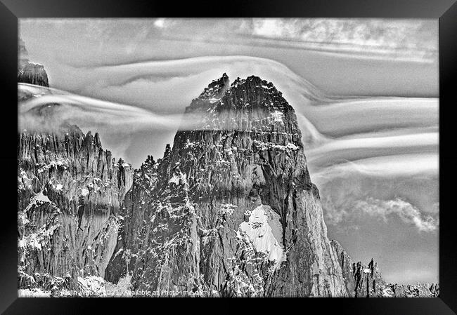 Clouds forming around the Aiguille de Dru in the French Alps Framed Print by Colin Woods