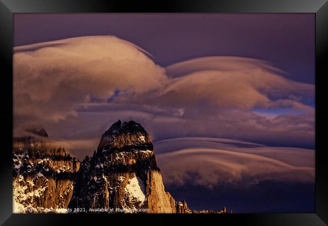 Clouds forming around the Aiguille de Dru in the French Alps Framed Print by Colin Woods