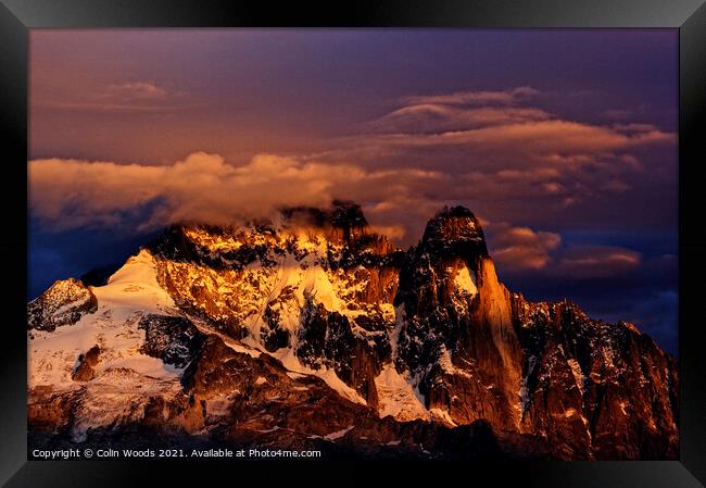 Clouds on the summit of the Aiguille Verte at Sunset Framed Print by Colin Woods